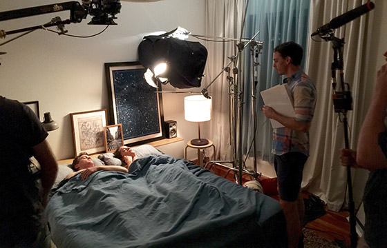 BedHead director Benjamin Mathews talks to cast members Paul Ayre and Sarah Bishop.