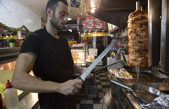 Rami carves meat in Kebab Kings-560